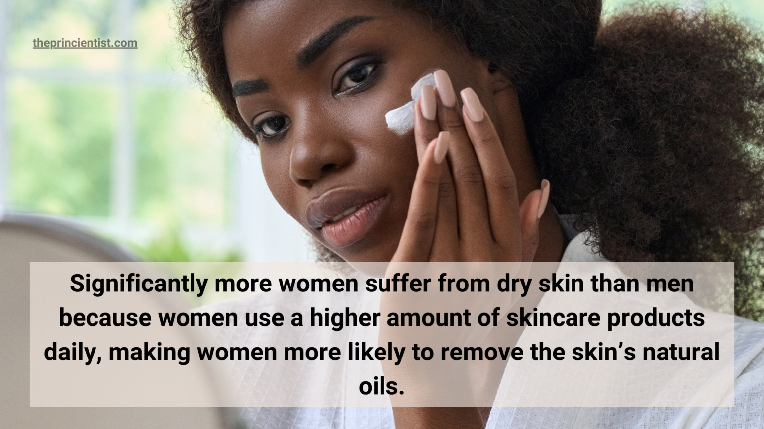 what is your skin type - woman with dry skin is applying moisturizer on her face