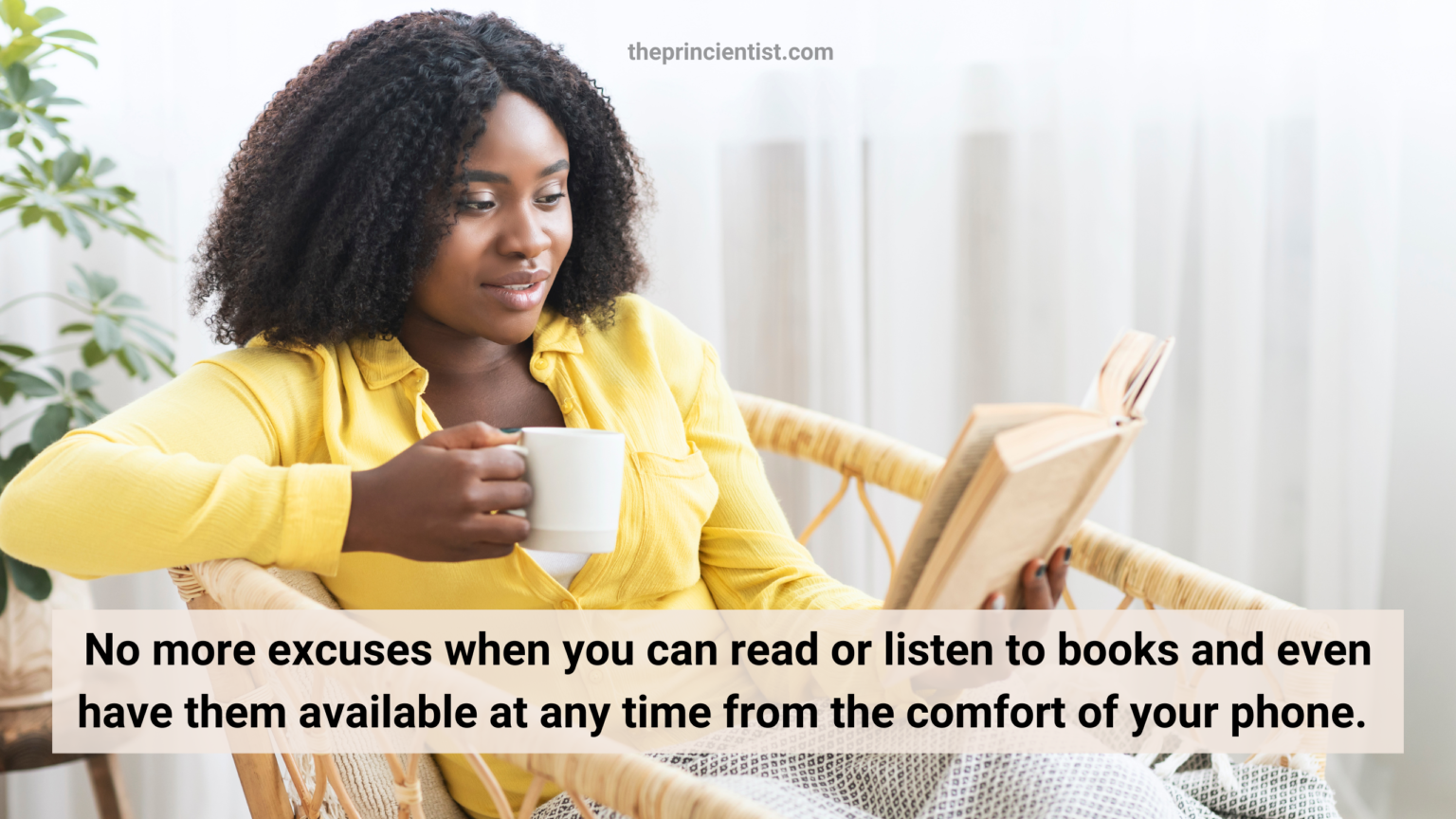 black woman sitting in the couch reading a book in enjoyment and holding a teacup of which I hope is wine