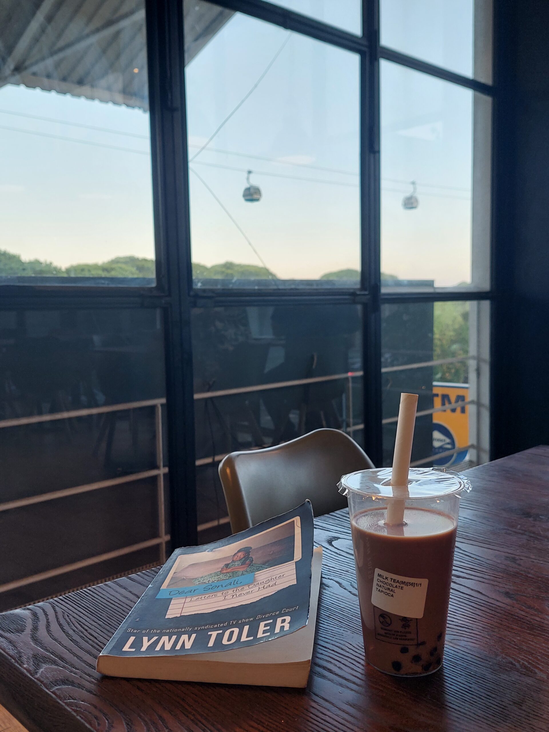 book and bubble tea and the view of the coffe place