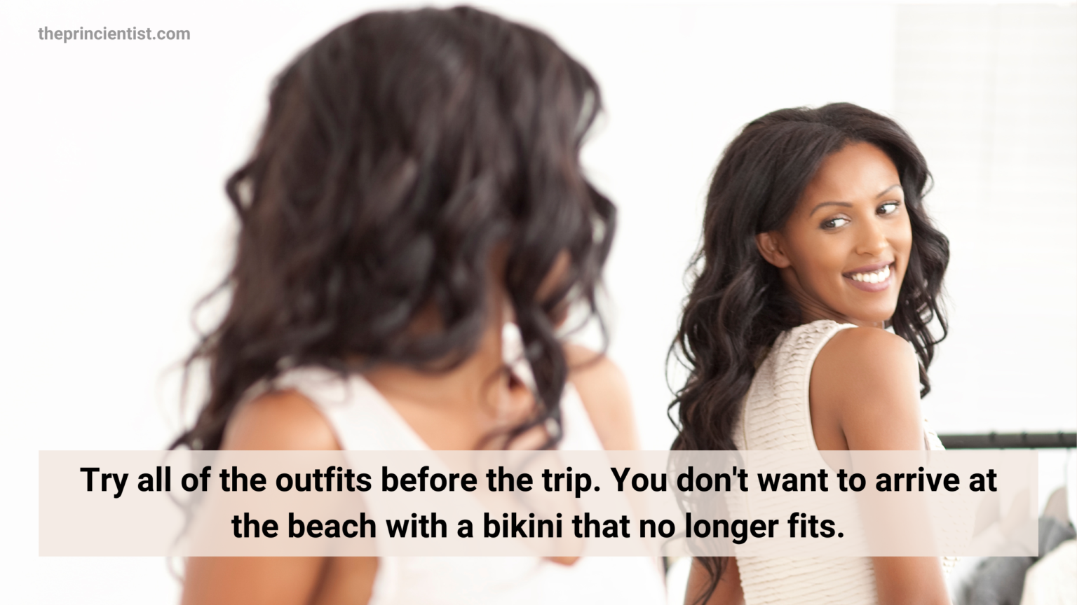 woman tries on vacation outfits in front of the mirror